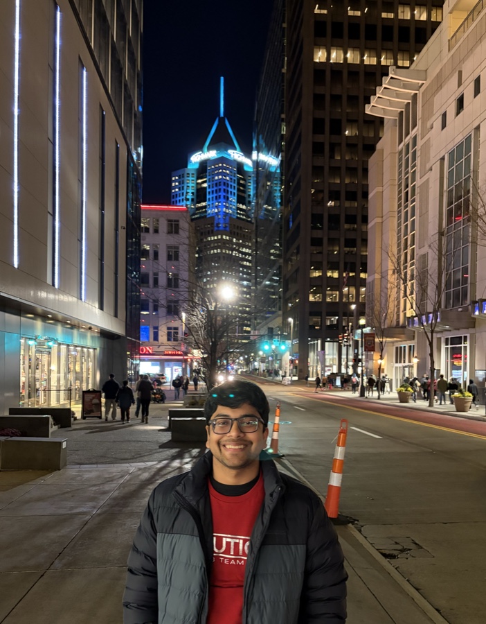 Arnav Goel, standing on a downtown Pittsburgh street at night